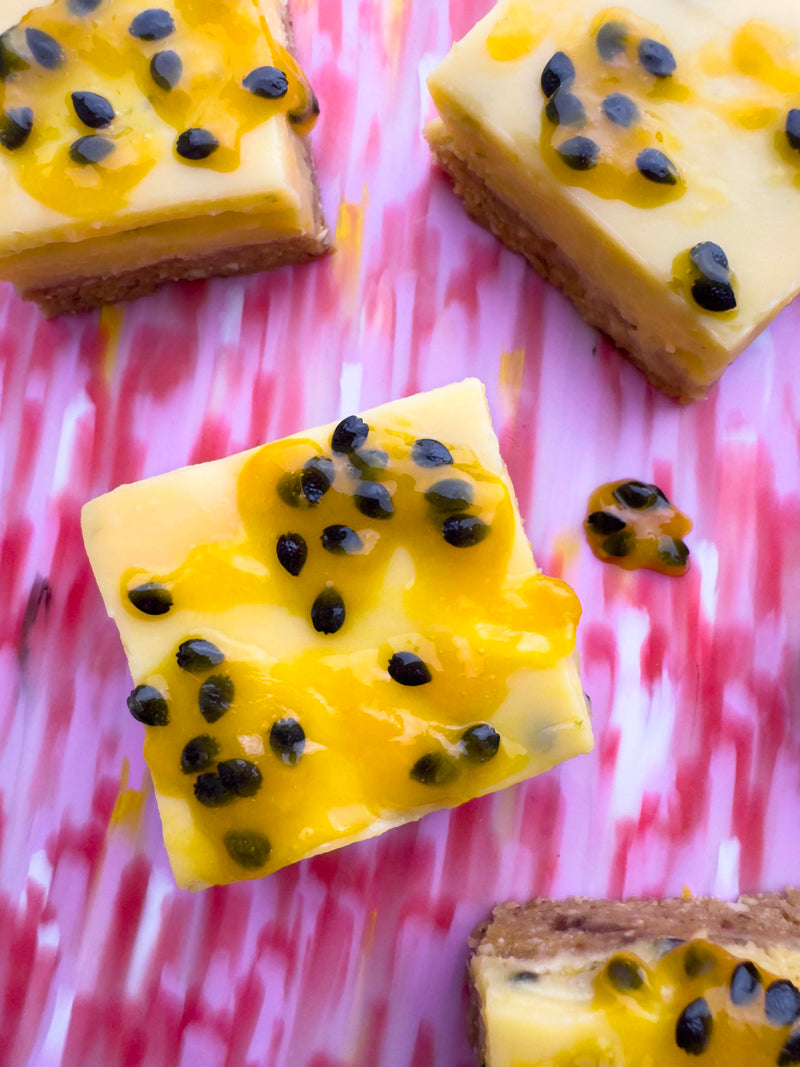 Fertility boosting dessert: passionfruit slice squares topped with passionfruit pulp and seeds